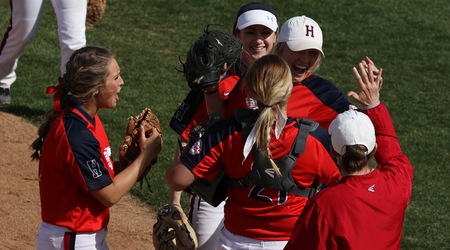 Blue Dragon players and head coach Jaime Rose congratulate rightfielder Brynne Stockman after robbing a home run in the seventh inning of a 4-3 Dragon victory in Game 1 over No. 9 Highland on Thursday at Fun Valley. (Joel Powers/Blue Dragon Sports Information)