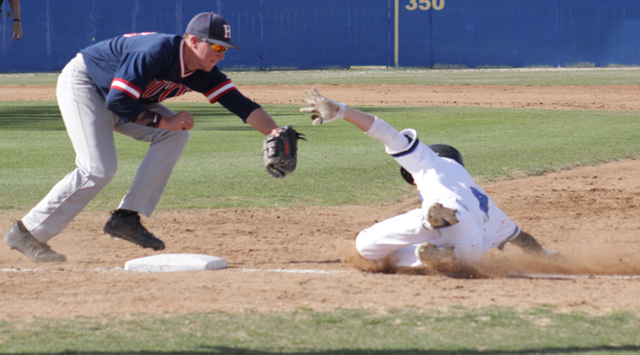 Blue Dragon first baseman Zach Baxley tags out a Barton baserunner in the second inning of a 14-4 loss to the No. 18 Cougars on Tuesday in Great Bend. (Photo courtesy Barton Sports Information)