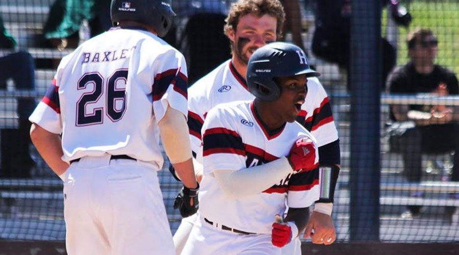 Jeremiah Ceasar scores the winning run in the bottom of the ninth inning of a 7-6 victory in Game 1 on Saturday at Hobart-Detter Field. (Bre Rogers/Blue Dragon Sports Information)