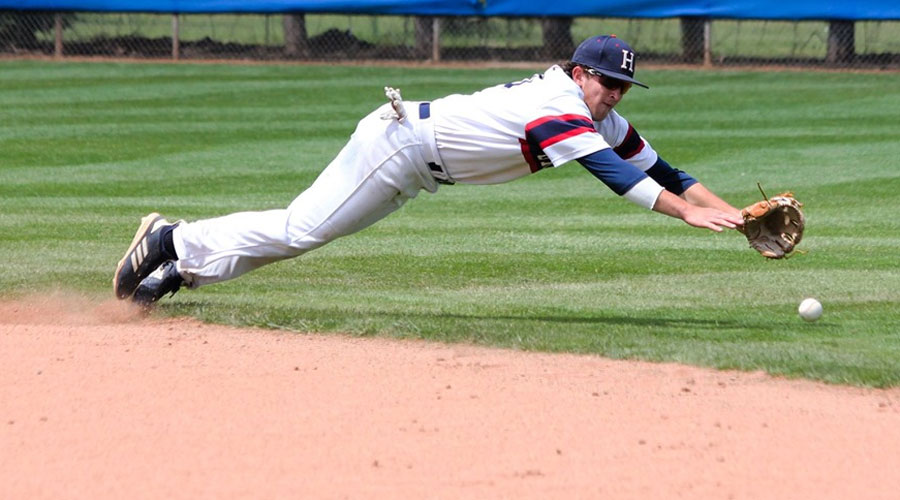 Second baseman Ryan Moritz dives for a ball that sneaks into right field to produce a run in Hutchinson's 4-3 loss to Labette in Game 1 of the Region VI Opening-Round series on Friday at Hobart-Detter Field. (Bre Rogers/Blue Dragon Sports Information)