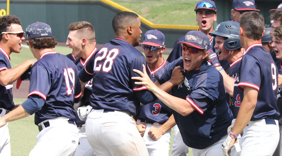 The Blue Dragons celebrate after Logan Sartori hit a two-run walk-off home run as Hutch rallies from eight runs down to defeat Cloud County 14-12 in an elimination game on Friday at Eck Stadium in Wichita. (Bre Rogers/Blue Dragon Sports Information)