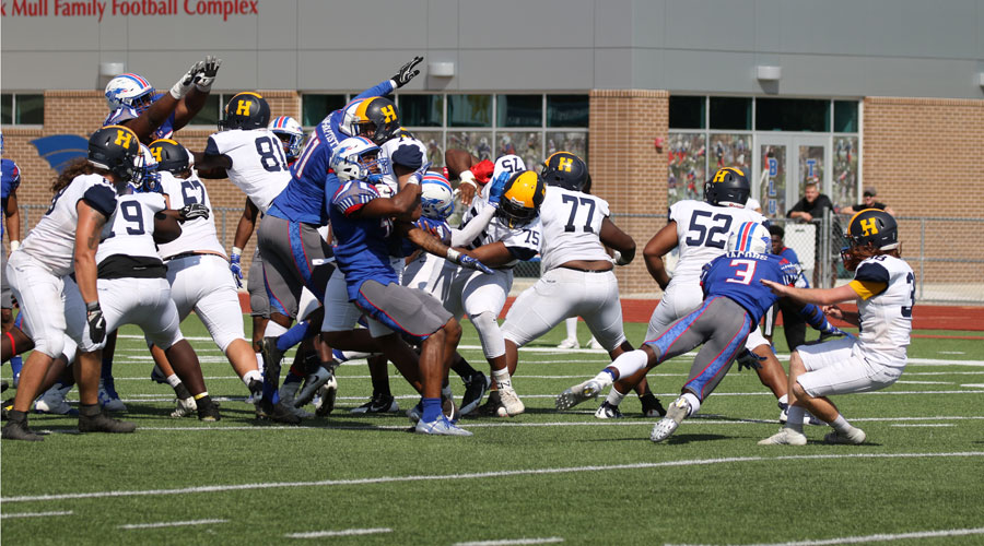 The Blue Dragons go after a 39-yard field goal attempt on the game's final play of a 13-10 double-overtime victory for Hutchinson over Highland on Saturday at Gowans Stadium. (Joel Powers/Blue Dragon Sports Information)