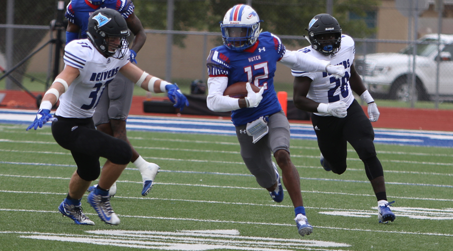 Jaylen Erwin breaks away from a pair of Iowa Western defenders on his way to a74-yard punt return for a touchdown in No. 11 Hutchinson's 33-24 loss to No. 1 IWCC on Saturday at Gowans Stadium. (Joel Powers/Blue Dragon Sports Information)