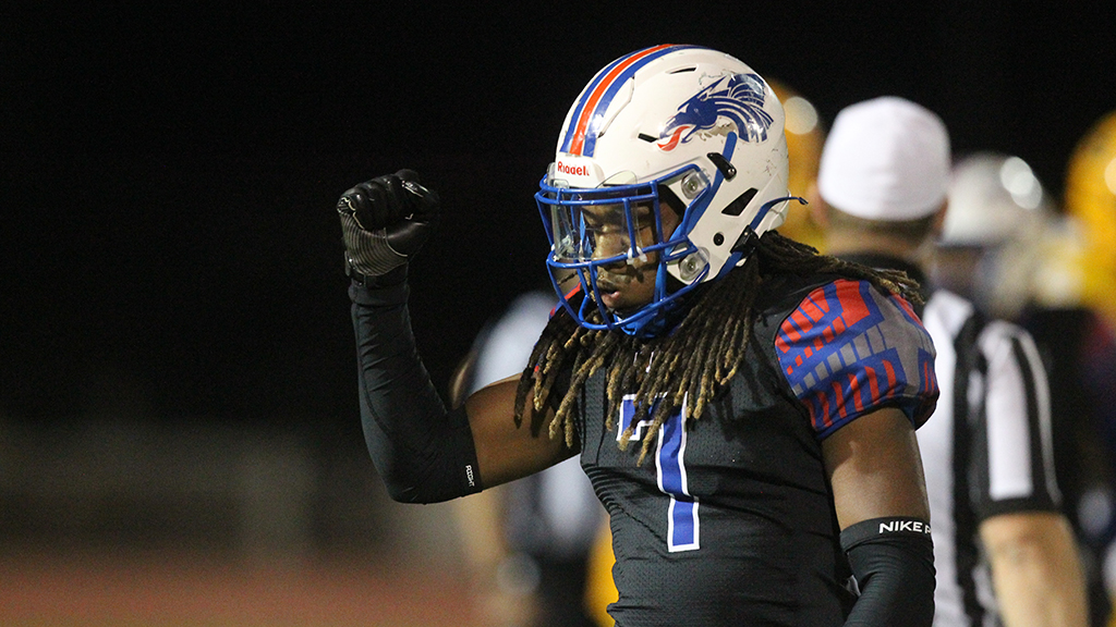 Marquise Gilbert gives a fist pump after the Blue Dragon football team rallies for two fourth-quarter touchdowns to knock off No. 8 Garden City 24-16 on Saturday night in Garden City (Photo courtesy Billy Watson/The Hutchinson News)