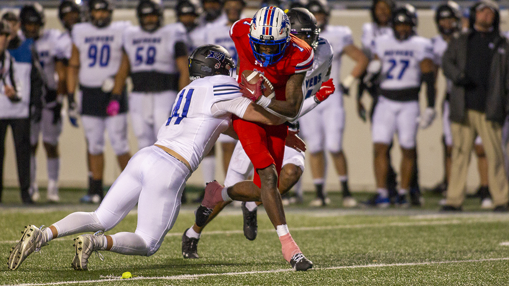 Blue Dragon receiver Malik Benson fights for yardage on Wednesday night at the NJCAA National Championship game vs. Iowa Western at War Memorial Stadium in Little Rock, AR. (Andrew Carpenter/Blue Dragon Sports Information)