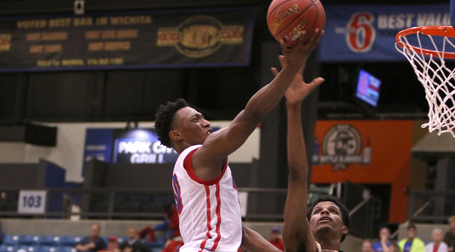 Devonte Bandoo scores two of his game-high 24 points in the Blue Dragons' 74-59 victory over Independence in the Region VI Tournament on Sunday at Hartman Arena in Park City. (Joel Powers/Blue Dragon Sports Information)