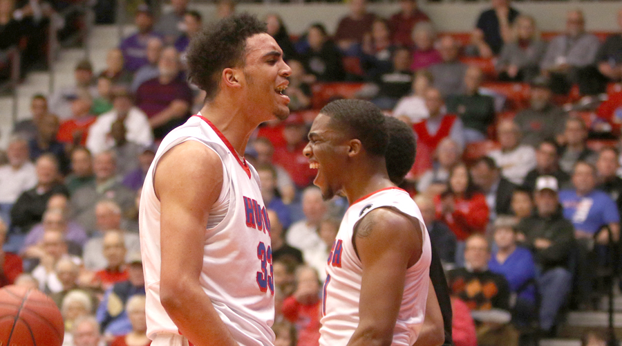 James Rojas (left) and J.J. Rhymes (right) react during a second-half surge on Tuesday as the Blue Dragons defeated Cape Fear 84-60 in the opening round of the 2018 Tournament at the Sports Arena. (Joel Powers/Blue Dragon Sports Information)