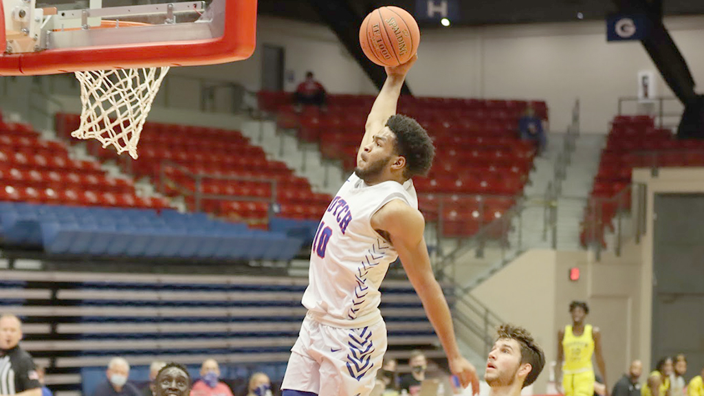 Chris Robinson goes high for a dunk in the No. 23 Blue Dragons' 86-64 win on Saturday over Garden City at the Sports Arena. (Dylan Shah/Blue Dragon Sports Information)