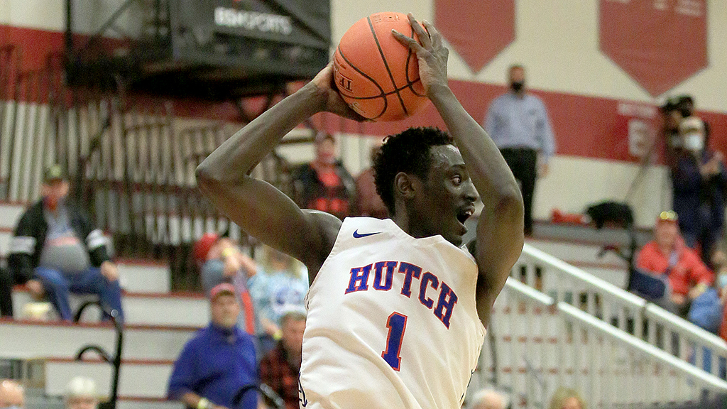 Kajok Kuath grabs this rebound and eventually hits the game-winning shot with 1.2 seconds left in regulation of Hutchinson's 76-75 Region VI Tournament semifinal victory over Coffeyville on Friday in Wichita. (Photo by Sandra Milburn)