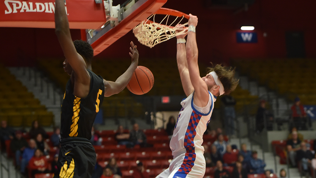 Kernan Bundy throws down a second-half dunk as No. 15 Hutchinson defeats Cloud County 75-56 on Saturday at the Sports Arena. (MacKenzie Franklin/Blue Dragon Sports Information)