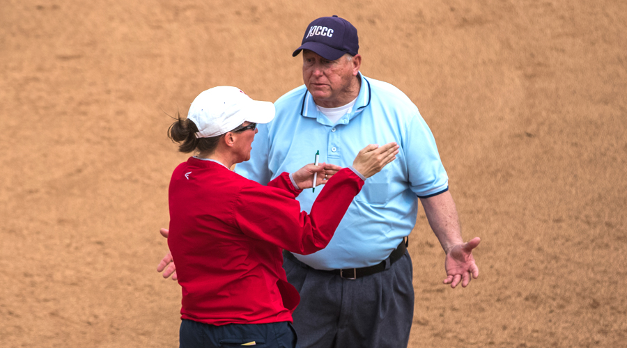 Jamie Rose discusses a call with the umpire late in Game 1 of Wednesday's doubleheader sweep of Kansas City at Fun Valley. Rose won her 400th victory in Hutch's 3-2 win in Game 1. (Allie Schweizer/Blue Dragon Sports Information)