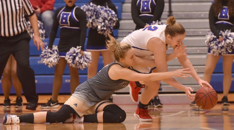 Abby Ogle battles for possession of the ball with any Independence player during No. 13 Hutchinson's 54-41 win over the Pirates on Saturday at the Sports Arena. (Andrew Carpenter/Blue Dragon Sports Information)