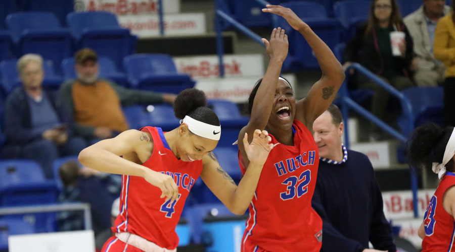 Jada Mickens (32) and Tijuana Kimbro (4) celebrate as the buzzer sounds after the Blue Dragon women defeated Odessa 66-50 on Thursday in the quarterfinals of the NJCAA Women's National Tournament in Lubbock, Texas. (Joe Morales/QuickShotz photography)