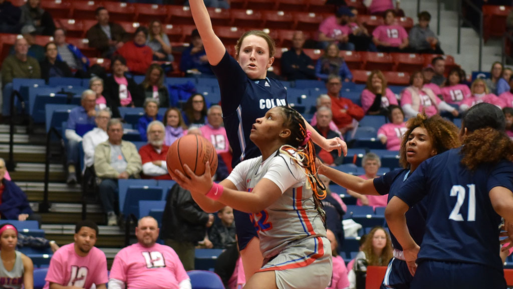 Mya Williams scoops and scores for two of her career-high 37 points in the No. 25 Blue Dragons' 86-75 victory over Colby on Saturday at the Sports Arena. (Sammi Carpenter/Blue Dragon Sports Information)