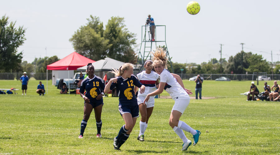 Sheena Nichol strikes a header for the match's first goal in a 6-0 Blue Dragon victory over Trinidad State on Sunday at the Salthawk Sports Complex. (Allie Schweizer/Blue Dragon Sports Information)