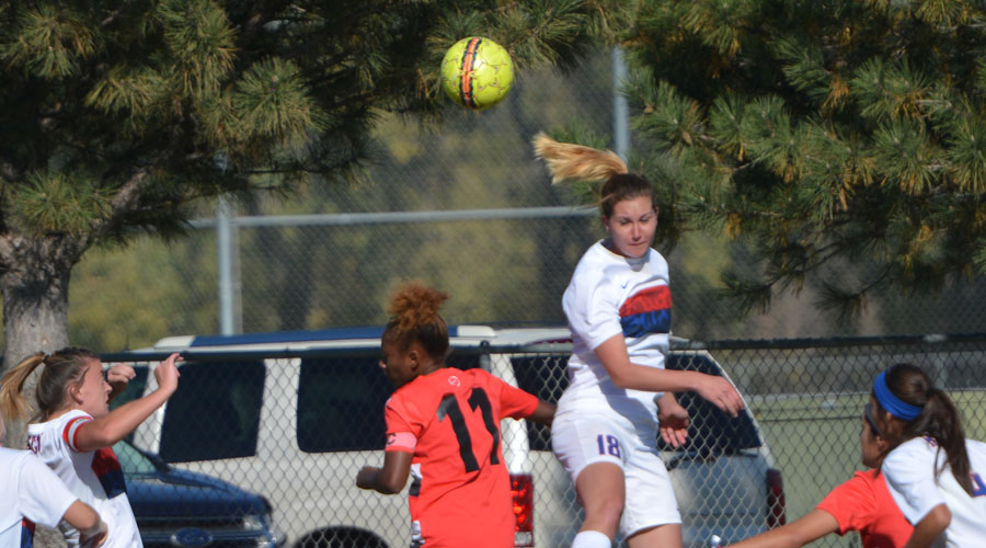 Ariel Wolff tries to send a header into the box in the second half of Saturday's Blue Dragon Women's Soccer 2-1 loss to Coffeyville in the opening round of the Region VI Tournament at the Salthawk Sports Sports Complex. (Steve Carpenter/Blue Dragon Sports Information)