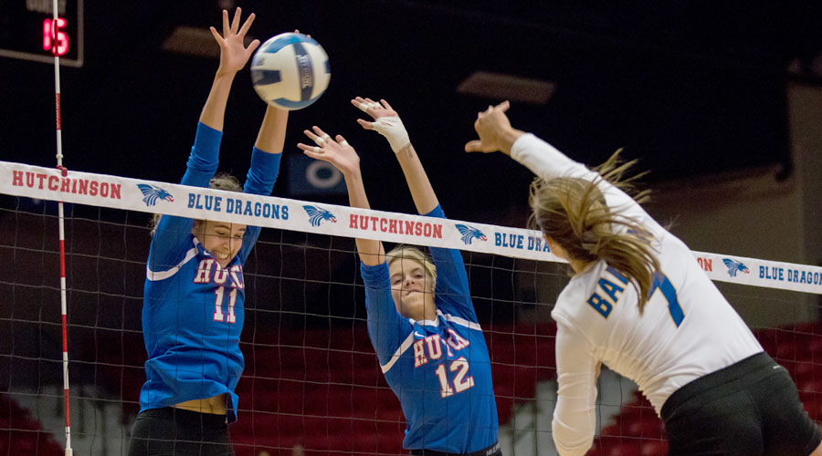 Leonie Wienkaemper (11) and Lexi Hogan (12) go up for one of Hutchinson's 10 team blocks on Wednesday as the Blue Dragons defeated Barton 3-1 at the Sports Arena. (Allie Schweizer/Blue Dragon Sports Information)