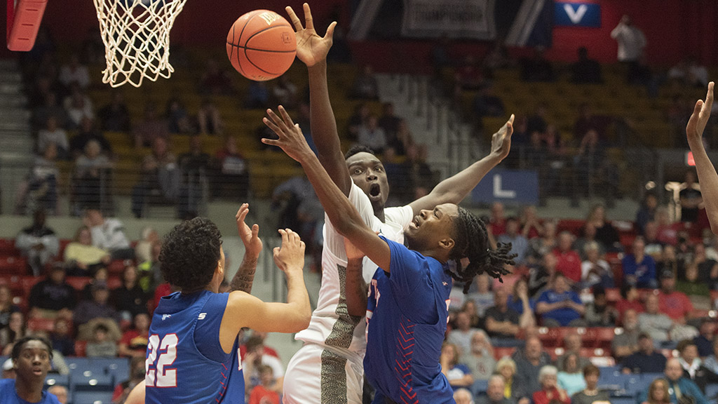 Kobe Campbell takes the ball to the hoop and draws a foul against Chipola on Wednesday in the second of the NJCAA Tournament in the Sports Arena. (Steve Carpenter/Blue Dragon Sports Information)