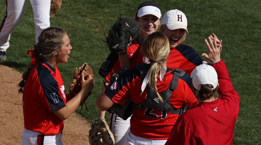 Blue Dragon players and head coach Jaime Rose congratulate rightfielder Brynne Stockman after robbing a home run in the seventh inning of a 4-3 Dragon victory in Game 1 over No. 9 Highland on Thursday at Fun Valley. (Joel Powers/Blue Dragon Sports Information)