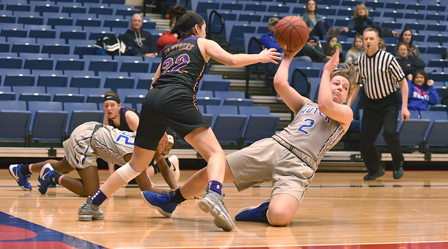 Abby Ogle goes to the floor for a steal in No. 6 Hutchinson's 95-22 rout of Ellsworth in the Polo Bar & Grill/Blue Dragon Holiday Classic on the Sports Arena. (Andrew Carpenter/Blue Dragon Sports Information)