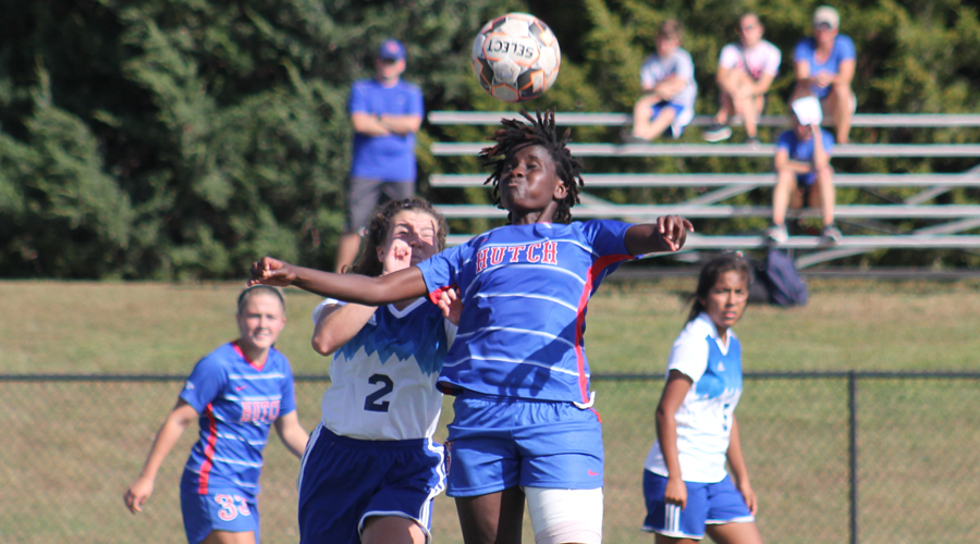 Naomi Waithira battles for the ball with a Barton defender during Hutchinson's 4-2 loss to the Cougars on Wednesday in Great Bend. (Photo courtesy Todd Moore/Barton Sports Information)