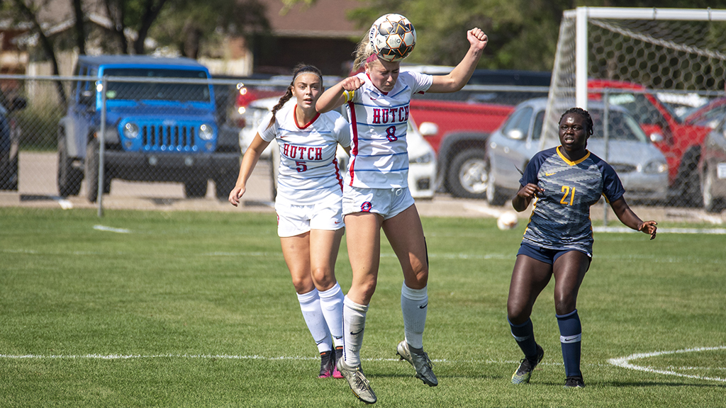 Aimee Maher heads the ball near midfield during the first half of Saturday's Blue Dragon women's soccer 1-0 loss to Johnson County on Saturday at the Salthawk Sports Complex. (Andrew Carpenter/Blue Dragon Sports Information)